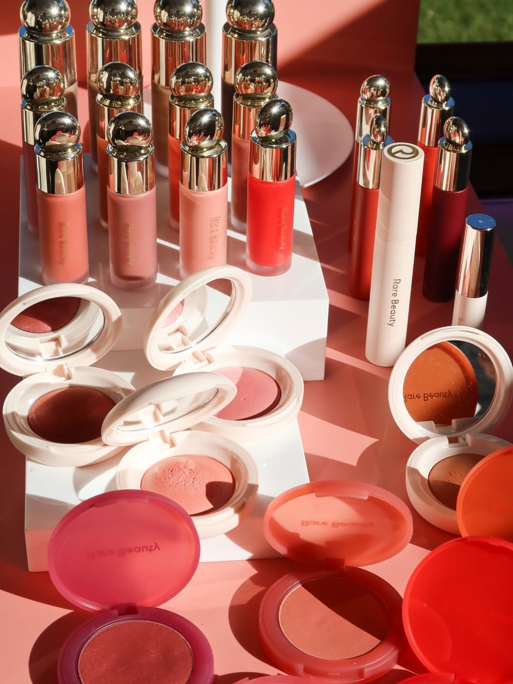 Rare Beauty product display styled inside the activation